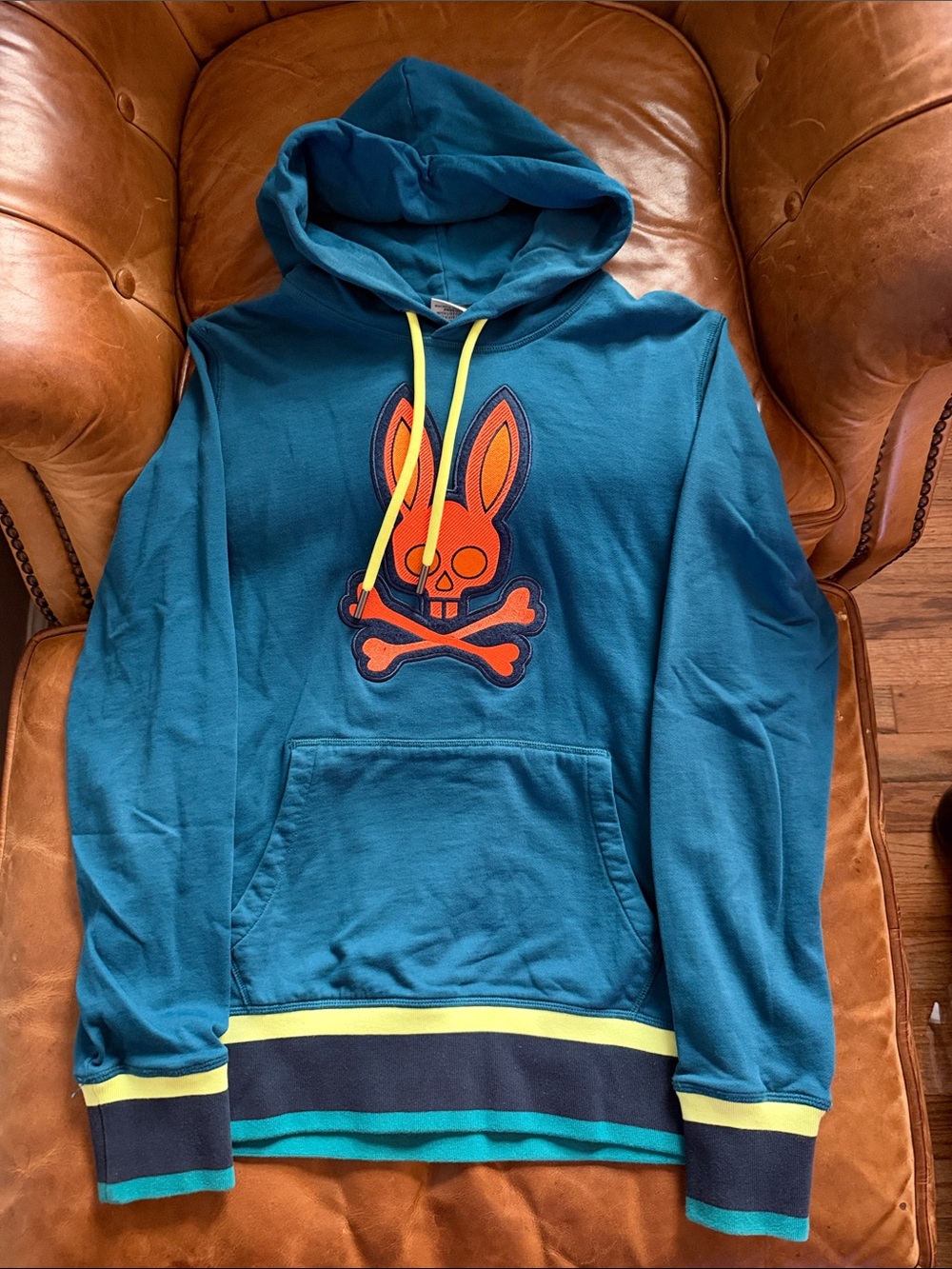 Psycho Bunny Teal Hoodie with Orange Bunny Logo and Yellow Accents